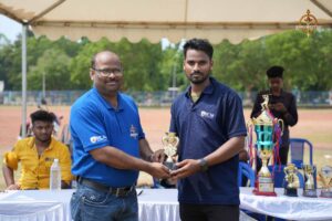 Cricket players receiving trophy at Ranbhoomi during Brahmastra 2025, celebrating intercollege sportsmanship and victory.