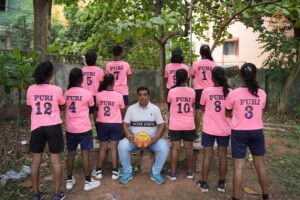 Girls throwball team posing with coach on the field during Brahmastra 2025 Kurukshetra event