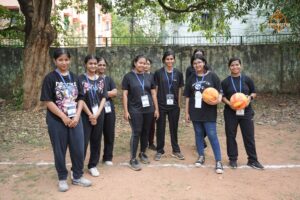 Girls' team group photo on the field during Brahmastra 2025 Kurukshetra Throwball event