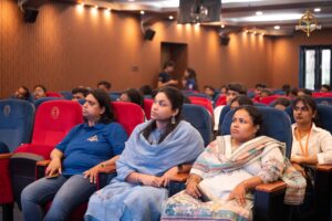 Faculty and students attentively watching the stage during the Navya Sopna event at Brahmastra 2025 college festival.