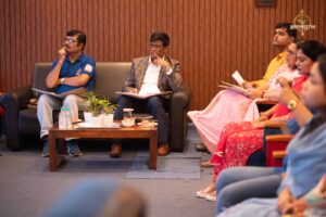Judges and faculty in deep discussion during Navya Sopna at RCM's Brahmastra 2025 college festival event.