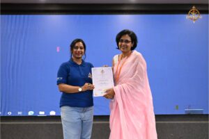Faculty member presenting certificate to a woman startup entrepreneur participant during Brahmastra 2025 college festival event.