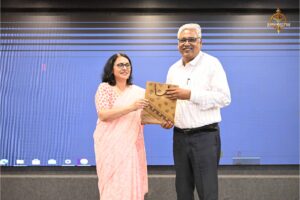 Faculty presenting a token of appreciation to judges during Navya Sopna at college festival Brahmastra 2025.