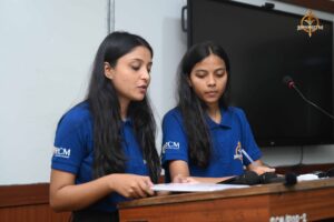 Students presenting on stage during the Recruitment Expo at Brahmastra 2025.