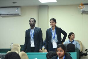 Two student participants speaking into a mic during the Recruitment Expo at Brahmastra 2025.