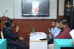 Student speaking confidently with a mic during Recruitment Expo at Brahmastra 2025.