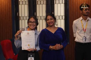College festival winner smiling with certificate at Brahmastra Samvad Vivaad, best event in India.