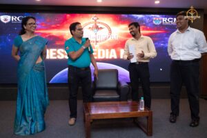 Judge speaking on stage at Samvad Vivaad during Brahmastra, top college festival in India, RCM