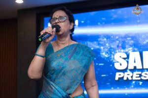 Principal speaking on stage during Samvad Vivaad at Brahmastra, best college festival in India for management aspirants.