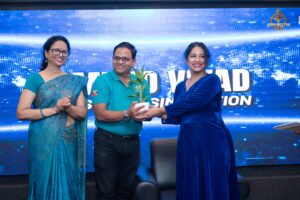 Faculty presents a plant to the judge during Samvad Vivaad at Brahmastra, best college festival in India.