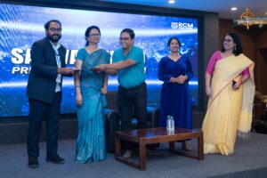 Group photo showing judges, student participants, and faculty during Samvad Vivaad at Brahmastra college festival event.