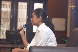 Students at Brahmastra college festival enact public figures on stage during Samvad Vivaad roleplay event session.
