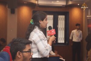Student reporter questions participant during Samvad Vivaad at Brahmastra, best college festival in India, RCM.