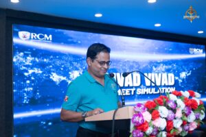 Judge addressing audience during Samvad Vivaad at Brahmastra, top management college festival in India.