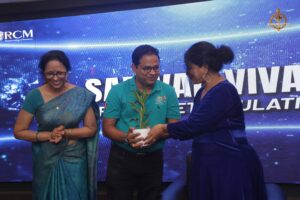 Faculty presenting a plant to judge at Brahmastra, India’s best college festival at top management college RCM.