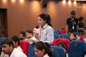 Students portraying reporters question peers enacting public figures during Brahmastra college festival’s Samvad Vivaad event.