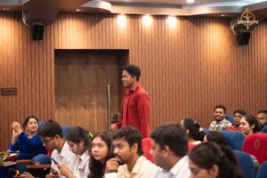 Students portraying reporters question public figures during Samvad Vivaad at Brahmastra college festival in India.