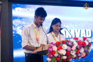 Student anchor hosting Samvad Vivaad on stage during Brahmastra, top college festival at RCM India.