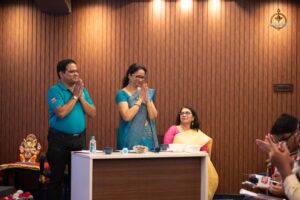 Judge and faculty addressing audience respectfully during Samvad Vivaad at Brahmastra, top college festival in India.