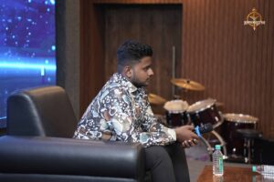 College festival participant at Brahmastra portraying a public figure during Samvad Vivaad at top management college event.