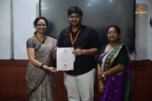 Participants receive certificates from principal and faculty during Vishwa Tark Vitark at Brahmastra college festival event.