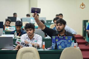 Participant raises hand during Vishwa Tark Vitark at Brahmastra, best college festival in India, RCM Bhubaneswar.