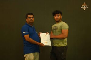 Certificate distribution to participants at Brahmastra 2025 Kurukshetra Arm Wrestling event.