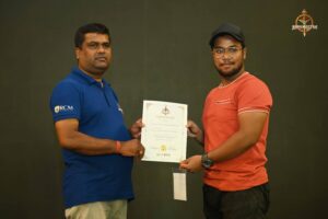 Certificate distribution ceremony for participants of Brahmastra 2025 Kurukshetra Arm Wrestling event at RCM Bhubaneswar.