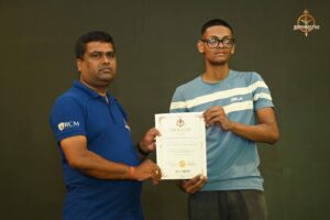 Participants receiving certificates on stage during Brahmastra 2025 Kurukshetra Arm Wrestling event at RCM Bhubaneswar