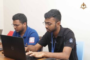 College festival Brahmastra participants discussing UI/UX designs during MetaWeb hackathon at top management college in India.