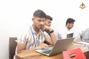 Participants at Brahmastra's MetaWeb hackathon focused on UI/UX design at top management college event.