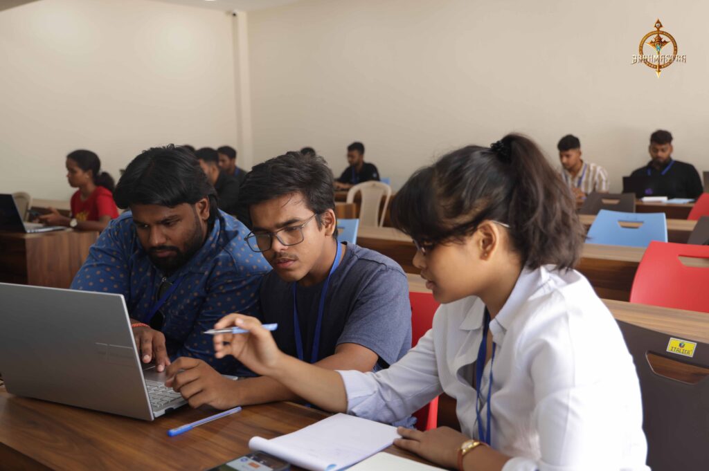 Group of college students brainstorming UI/UX designs during MetaWeb at Brahmastra, best college festival in India.