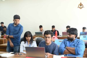 Judges evaluating UI/UX entries during MetaWeb at Brahmastra, best college festival in India by top management college.