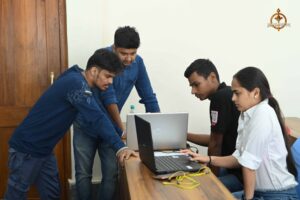 Judges and participants discuss UI/UX designs during MetaWeb at Brahmastra, top college festival in India.