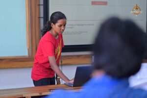 College festival participants present UI/UX project to judges during MetaWeb hackathon at Brahmastra 2025 event