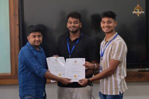 Students receiving certificates from judges at MetaWeb hackathon during Brahmastra, best college festival in India.