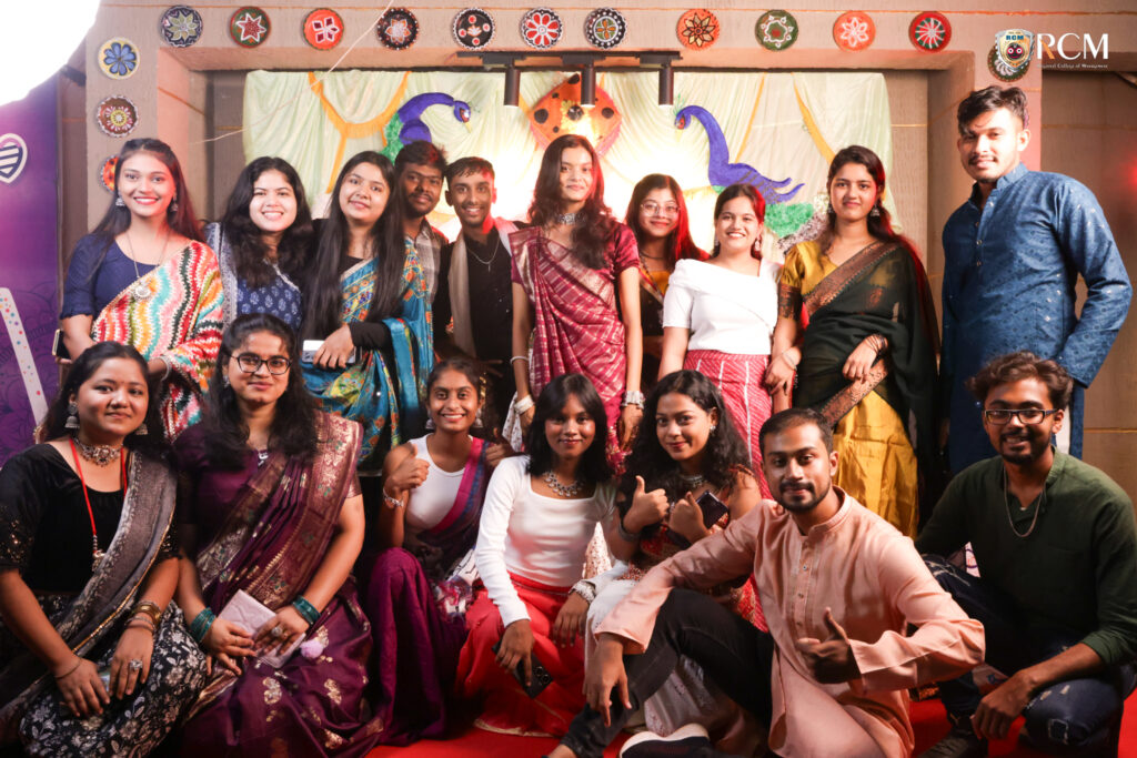 Group of students in colorful traditional attire enjoying Mega Dandiya Night 2025 at RCM Bhubaneswar campus.