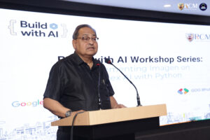 Dean of Academics addressing students during AI workshop at RCM