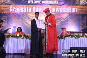 Graduate receiving certificate at RCM's "Graduate Day & Convocation" ceremony.