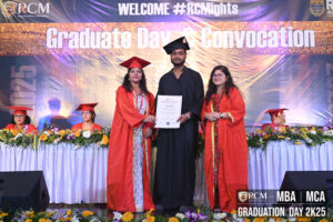 Graduation ceremony by Regional College of Management, graduate receiving certificate on stage.