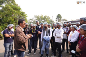Group photo outside Milk Mantra plant during RCM visit