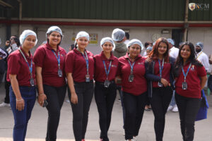 RCM students watching milk processing line on industry visit