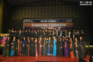 Graduates on stage in caps and gowns at RCM's 2025 Convocation celebration.