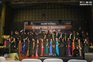 RCM Global School Graduation Celebration Graduates celebrate on stage during RCM Global School's Convocation, wearing caps and gowns.