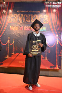 RCM graduation event with "Night of Oscar Jam" banner and graduate.