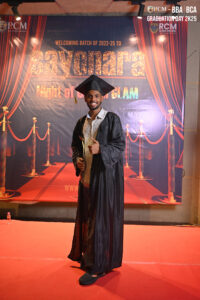 Graduation photo with cap and gown, holding certificate; "sayonara" theme, RCM Global B-school.