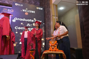 Graduation ceremony with red academic robes, Ganesha idol, and "WELCOME Graduate Day & Convocation" screen.