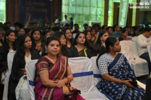 Graduation ceremony with attendees in traditional attire and gowns, labeled "Graduation Day 2K25".