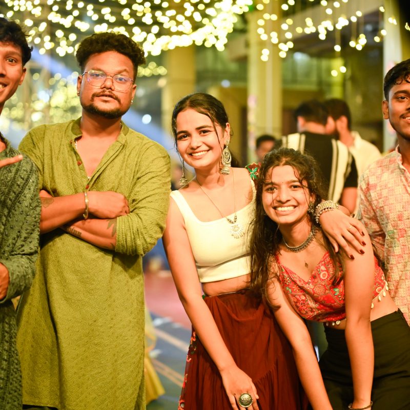 Students enjoying Mega Dandiya Night 2025 at RCM with vibrant dance, music, and festive decorations.