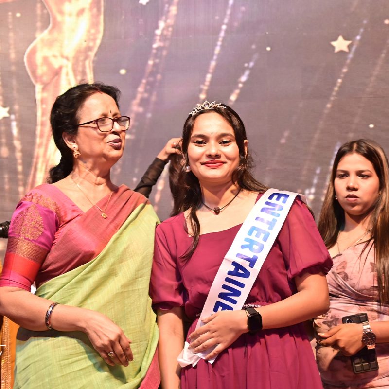Student getting awarded as Miss entertainment